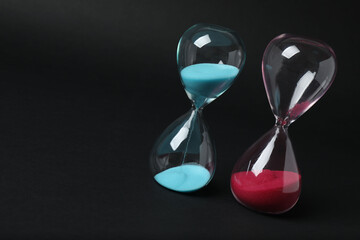 hourglass on a black background
