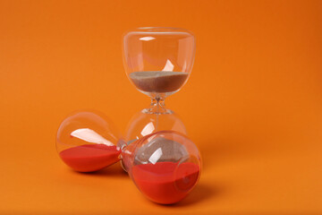 hourglass on an orange background
