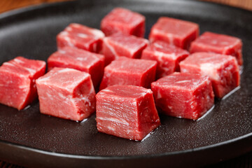 Fresh Diced Beef Cubes Cut and Ready for Cooking in Non-Stick Pan