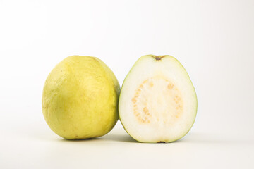 Fresh White Guava Fruit Whole and Sliced on Cream Background