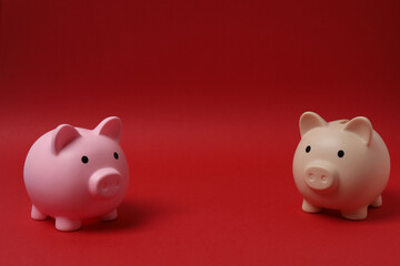 piggy bank, money dollars euros on a red background
