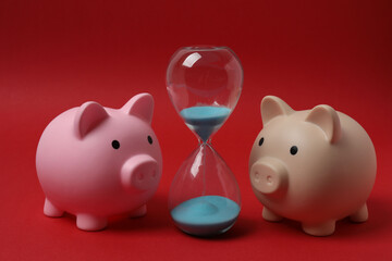 piggy bank, money dollars euros on a red background
