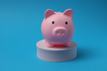 piggy bank, money dollars euros on a blue background
