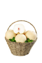 Fresh White Peaches in Wicker Basket with Mint Leaves on White Background