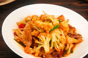 Golden Cauliflower Stir Fry with Mixed Vegetables on White Plate - Healthy Asian Cuisine