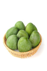 Fresh Green Mangoes in Wicker Basket on White Background