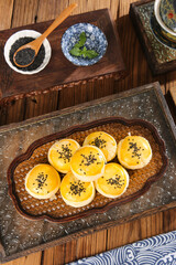 Asian Egg Custard Tarts with Black Sesame Seeds Traditional Dessert Tea Time Setting