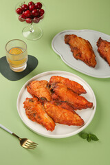 Crispy Spiced Gourmet Chicken Wings with Bone-In Seasoning and Fresh Cherry Garnish