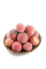 Fresh Blood Peaches in Wicker Basket Isolated on White Background
