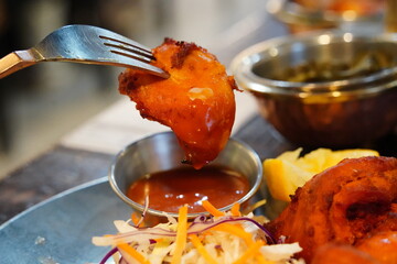 Indian Chicken Tikka Served with Lemon and Salad