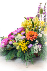 bouquet of different flowers on white background
