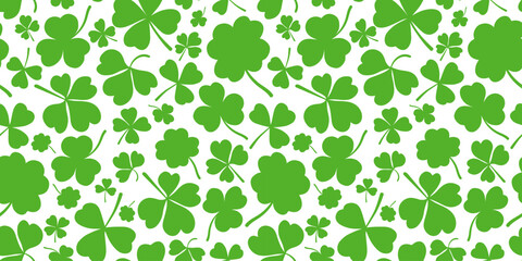 Shamrock or clover leaf horizontal green seamless pattern falling leaves on white background vector illustration. Irish holiday celtic St Patrick day motif seamless pattern with shamrock clover leaf.