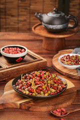 Traditional Chinese Tea Ceremony with Mixed Nuts and Peanuts on Wooden Table