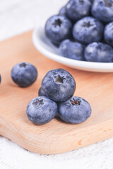 Fresh Yunnan Alpine Blueberries on Wooden Board - Healthy Organic Berry Fruit Duo