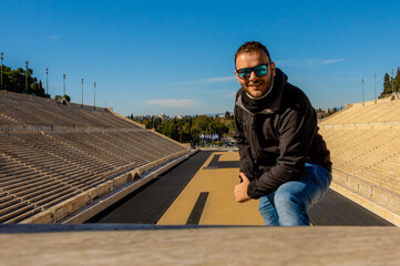 Man with sunglasses at Panathenaic Stadium in Athens, Greece.