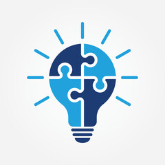 Single light bulb icon with four puzzle pieces represents the concept of ideas, innovation, and teamwork solutions. Vector illustration