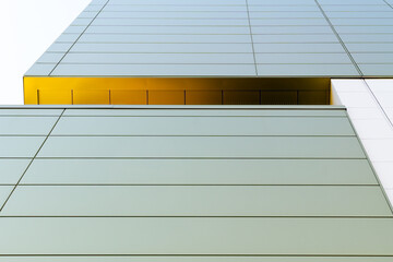 Minimalist office building with clean lines, geometric façade, and subtle color contrast under...