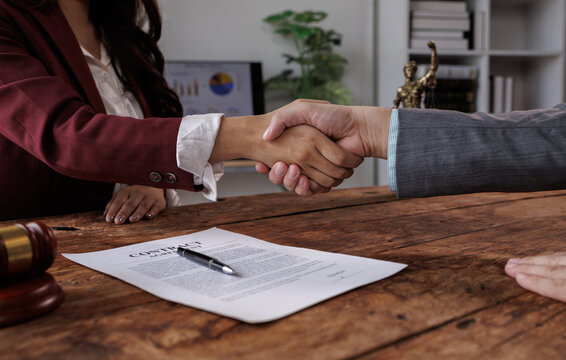 Lawyers provide legal advice, represent clients in court, and help with legal documents. They study laws and regulations to protect their clients' rights and interests handshake.
