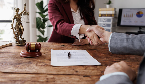 Lawyers provide legal advice, represent clients in court, and help with legal documents. They study laws and regulations to protect their clients' rights and interests handshake.
