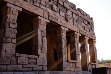 Ancient Stone Temple Ruins with Sunlight Beams Streaming Through Windows