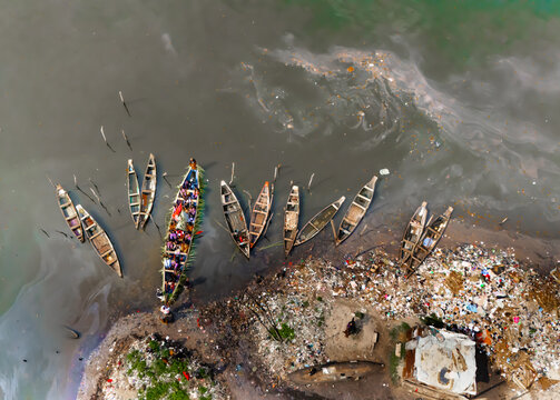 Aerial view of canoes clustered near the shore, the surrounding water and land makes it easy for people to access the canoes, Buguma, Rivers State, Nigeria.