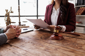 Notary with client in office,Judge gavel with Justice lawyers 
lawyer or judge counselor having...