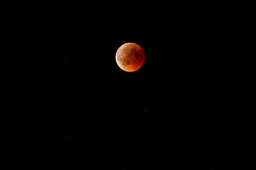 observe the blood moon with shadow of the earth over Austria in a dark night