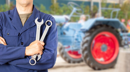 Tractor Pro Mechanic. Caucasian Service Worker with Heavy Duty Wrench Preparing For Complicated...