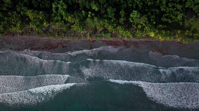 Papua New Guinea untouched remote coastline beach black sand Dogreto Bay large waves swell Wewak Madang PNG aerial drone Birdseye North New Guinea Papua island Yuo Mushi Island Harbor View left motion