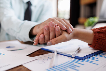 Business hand giving helping or encourage hands for the Young employees woman in the office.
