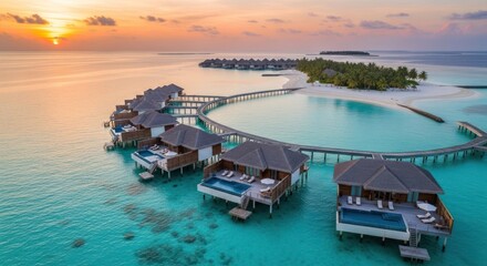 Luxury overwater bungalows at sunset in the Maldives, tropical paradise.