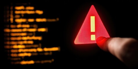 A finger points at a glowing red warning triangle with a yellow exclamation mark, against a backdrop of blurred, glowing lines of code