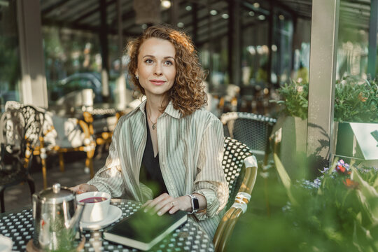 Businesswoman enjoying a peaceful cafe moment