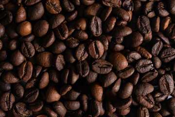 Roasted coffee beans close up background