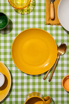 Vibrant tabletop setting with checkered tablecloth