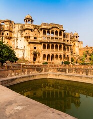 Fototapeta premium Ancient Indian palace by a pool