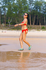 Fototapeta premium Woman with red bikini enjoy on beach