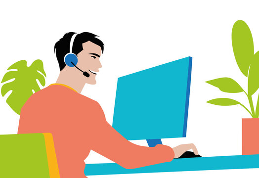 Man with a headset engages with clients, working on a computer in a office