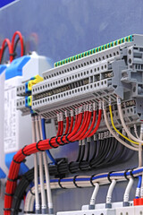 Electrical terminals with connected insulated copper wires with metal lugs. Marking with a thermal printer. 