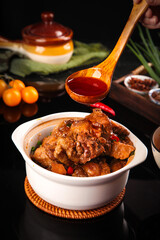 Homemade Oxtail Beef Stew in White Bowl with Wooden Ladle and Fresh Ingredients