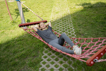 Woman relaxing in hammock during outdoor break
