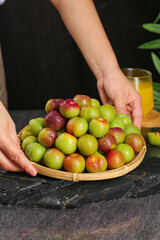 Fresh Red Green Plums in Bamboo Basket - Healthy Organic Fruit Display