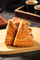 Traditional Five-Kernel Mooncakes Cut in Half with Tea - Chinese Mid-Autumn Festival Dessert