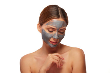A person applies a refreshing mud mask on their face while enjoying a moment of self-care. This...