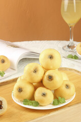 Fresh White Jade Loquats from Suzhou Dongshan China on Wooden Table Display with Wine Glass
