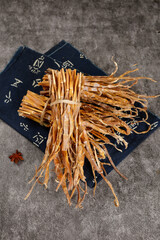 Dried bamboo shoots from Huangshan mountain on traditional Chinese calligraphy cloth for Asian cooking