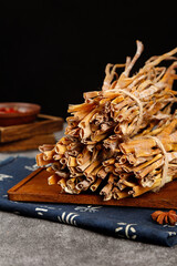 Dried Bamboo Shoots Bundle on Wooden Board - Traditional Asian Cooking Ingredient