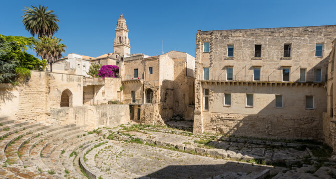 Ancient Roman amphitheater in Lecce under a bright sky