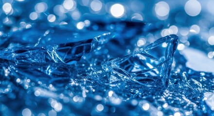 Abstract blue texture featuring fractured ice or glass fragments with shimmering bokeh lights, creating a cool, ethereal and modern background.
