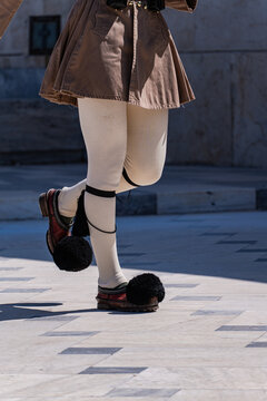 Traditional evzone footwear during a ceremonial march